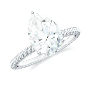 Pear Shaped Moissanite Solitaire Ring with Gold Twisted Rope